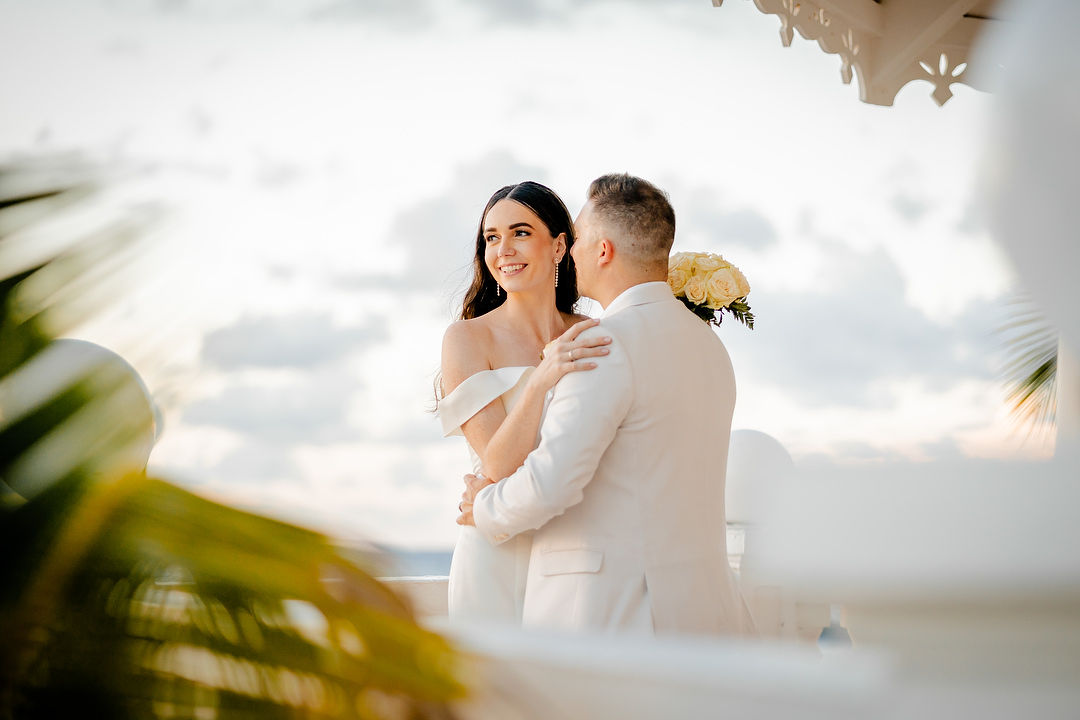 Couple embracing at sunset by gazebo wedding photography Ocho Rios Jamaica